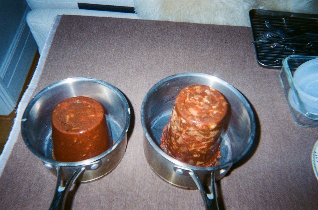 Stacked containers of tomato sauce